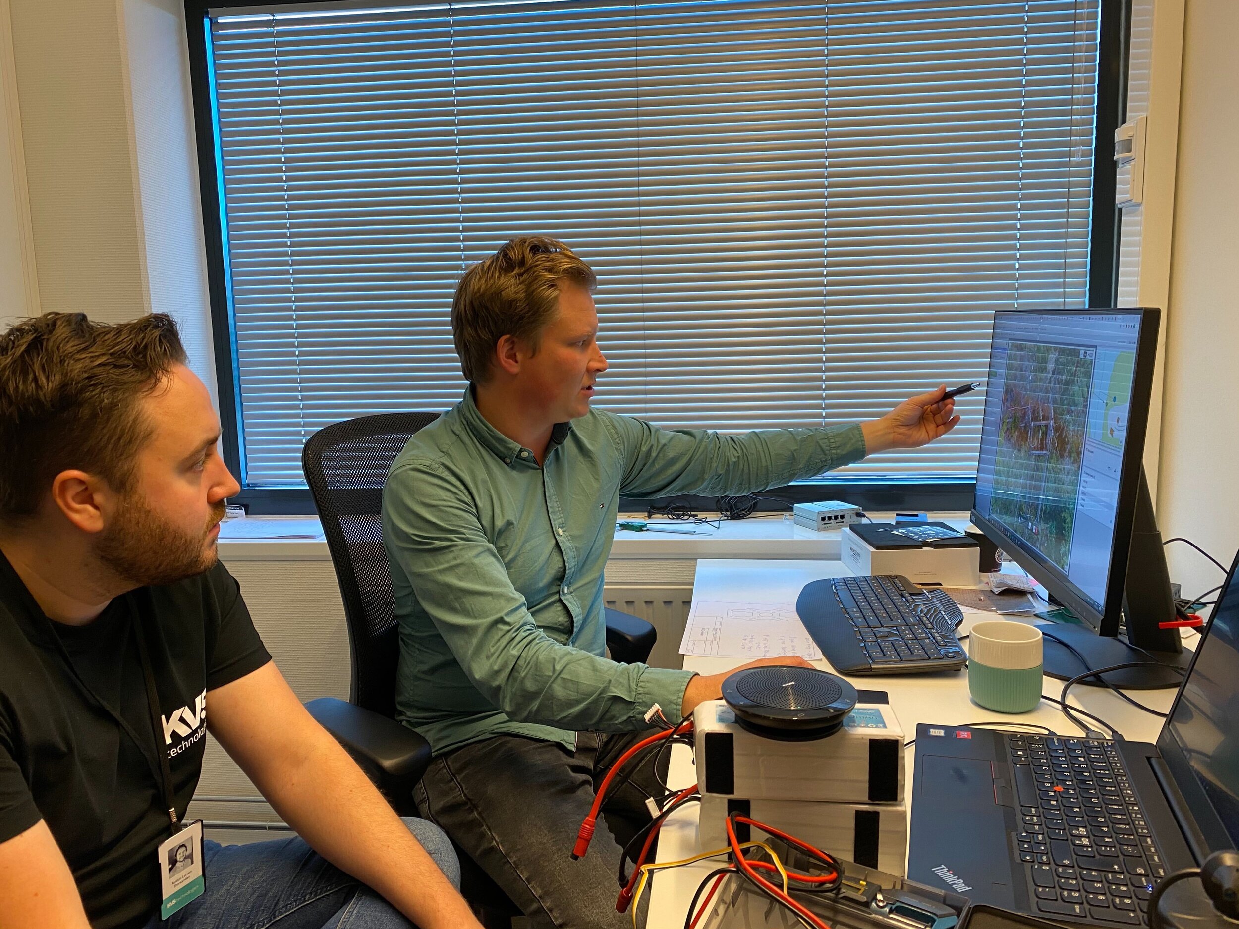 All systems go: Software engineer Audun Storsanden (left) and systems architect Steffen Solberg examine customer data together.
